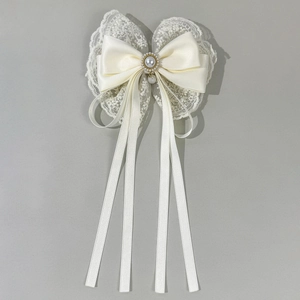 Elegant white lace bow hair clip with a pearl center and long satin streamers