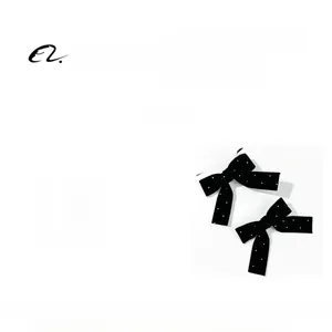 Detail view of velvet bow hair clips with rhinestones showing size 8.5x7.5cm and 9.8g weight