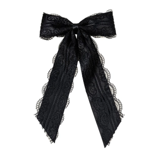 Elegant double-layered black lace bow brooch with vintage floral texture on white background