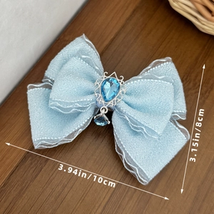 Detailed size view of blue lace bow hair clip with jewel, measures 10cm by 8cm