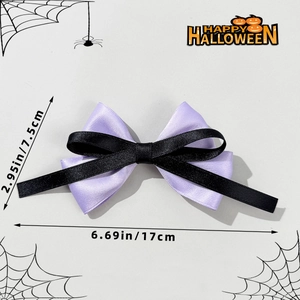 Detail showing the dimensions of the purple and black Halloween bow hair clip