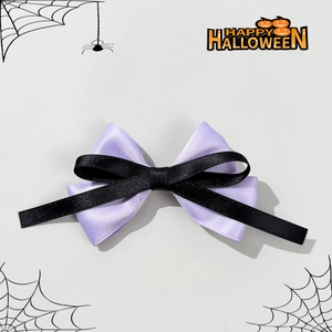 Halloween purple and black satin bow hair clip with gothic skull theme and creepy style