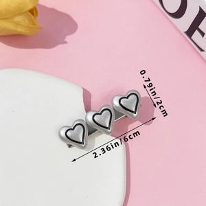 Silver triple heart hair clip measurement showing 6cm length and 2cm width dimensions