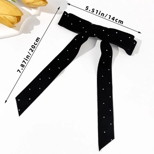 Elegant black velvet bow hair clip with sparkling rhinestones and long streamers