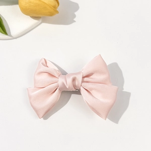 Pink satin bow hair clip for women with a minimalist elegant double layer design