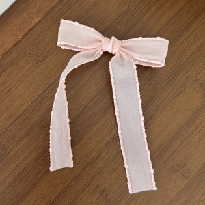 Pink ballet style mesh bow hair clip with ribbed ribbon and sheer layered ruffles