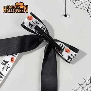 Halloween ribbon bow hair clip featuring pumpkin, black cat and bat festive patterns