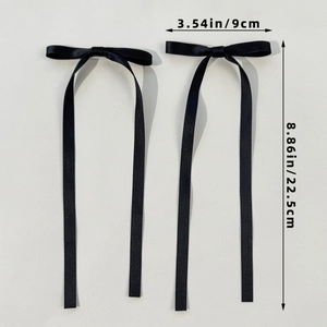 Elegante coppia di fermagli per capelli con fiocchi in raso nero e nastri lunghi