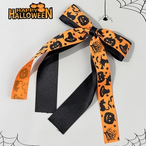 Halloween bow hair clip with orange pumpkin and black bat prints for women