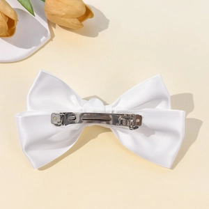 Elegant white satin oversized bow hair clip with silver spring fastener for women