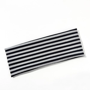 Detailed view of elastic striped sports headband with black and silver textured fabric