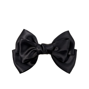 Elegant large black satin bow hair clip for women with multi-layered ribbon design