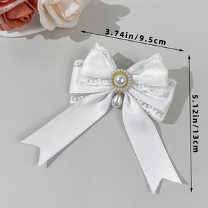 Elegant white lace bow hair clip with pearl pendant and satin layers for women