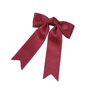 Elegant wine red satin double bow hair clip with long ribbons on white background