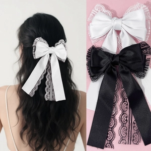 Elegant lace bow hair clip with long ribbons in black and white satin for women