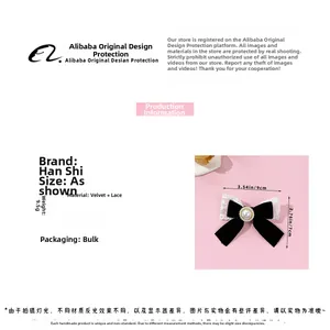 Detail view of a black velvet bow hair clip with white lace trim and center pearl decoration