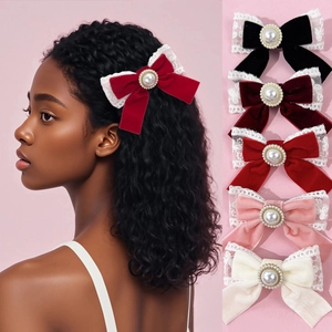 Velvet bow hair clips with lace trim and pearls in black, red, pink, and cream colors