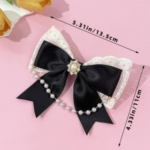 Vintage Lolita lace bow hair clip with pearls and rhinestones on a pink background