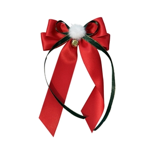 Christmas hair clip with red ribbon bow, green trim, white pompom and gold bell