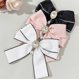 Elegant bow hair clips set with rhinestones and drop pearls in three vintage colors