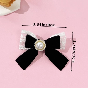 Velvet bow hair clip with white lace trim and pearl accent for elegant styling