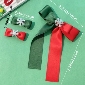 Christmas bow hair clip set in red and green satin with silver snowflake charms