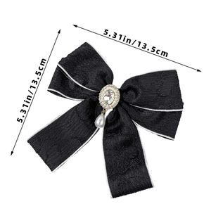 Elegant black bow hair clip with pearls and rhinestones measuring 5.31 inches in width