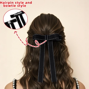 Elegant black bow hair clip and bowtie with white stitching detail for school style shirts