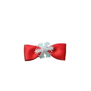 Red satin Christmas bow hair clip with a silver glitter snowflake on a white background