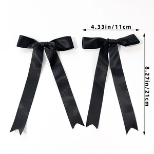 Set of two black satin ballet bow hair clips with long ribbons for elegant hair styling