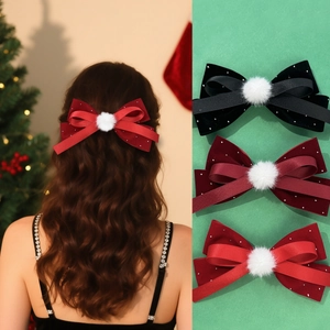 Velvet Christmas bow hair clip with rhinestones and plush ball for holiday hair styling