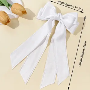 Elegant white satin bow hair clip with long ribbons, measuring 14.5cm by 26cm