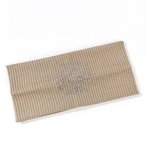 Close-up of khaki ribbed knitted headband featuring a silver rhinestone cross pattern