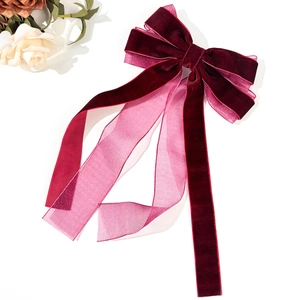 Elegant burgundy velvet and organza bow hair clip with long ribbon streamers detail