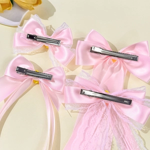 Pink satin bow hair clips set with white lace trim and metal duckbill clips for girls