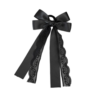 Elegant black satin bow hair tie with long streamers and delicate lace edges on white background