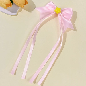 Pink ribbon bow hair clip with yellow star accent and long satin tassels for women