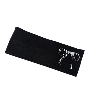 Black ribbed knitted headband featuring a sparkling rhinestone bow for sports and fashion