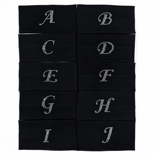Black elastic yoga headband with rhinestone alphabets A-J in a stylish knit texture