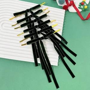Dark green velvet Christmas bows with gold twist ties for holiday gift wrapping decor