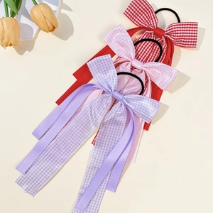 Three plaid bow hair clips with long ribbons in purple pink and red school style
