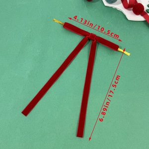Detail of red velvet Christmas bow with gold wire twist tie and size measurements