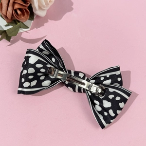 Elegant satin leopard print bow hair clip with silver spring metal fastener