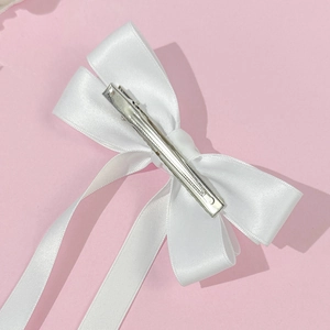 Elegant white satin bow hair clip with long ribbons and metal hair grip for women