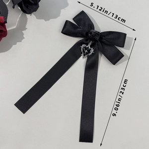 Gothic black satin bow hair clip with heart pendant measuring 13cm wide and 23cm long