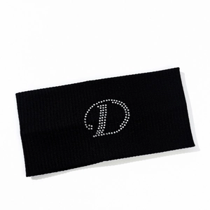 Close-up of black ribbed knit sports headband with rhinestone letter D embellishment