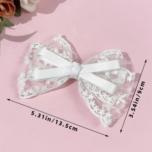 Detailed view of white French lace bow hair clip with dimensions 13.5cm by 9cm