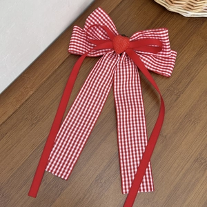 Red and white checkered bow hair clip with cute strawberry accent and flowing ribbons