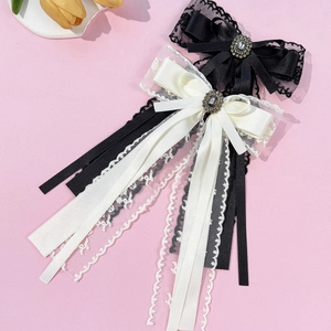 Elegant lace ribbon hair clips with vintage gemstones in black and creamy white