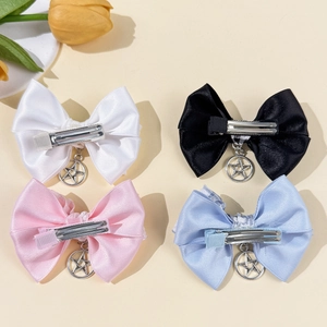 Barrettes nœuds avec pendentifs étoiles en noir, blanc, rose et bleu style satiné